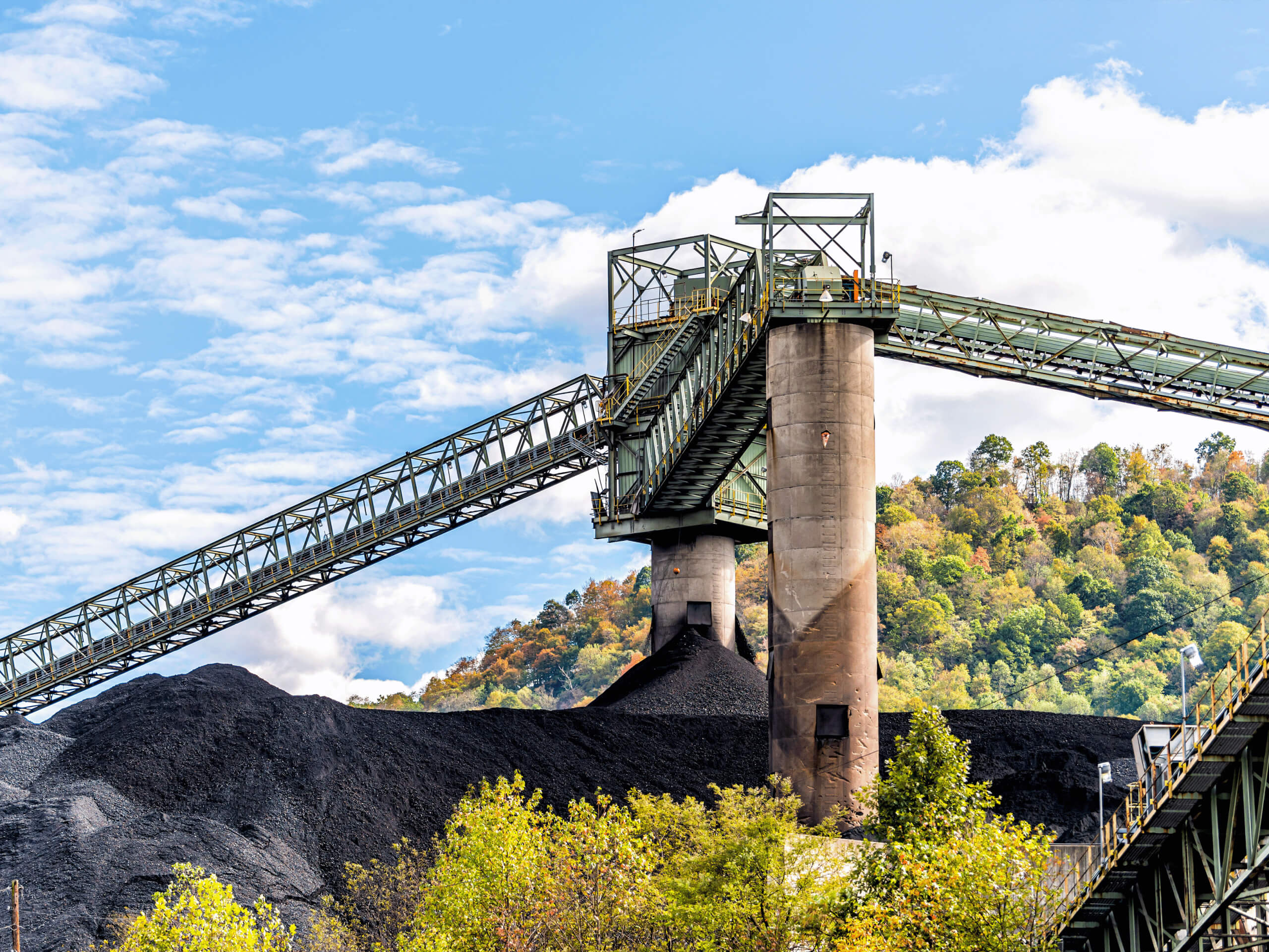 Technicians operating remote cleaning equipment