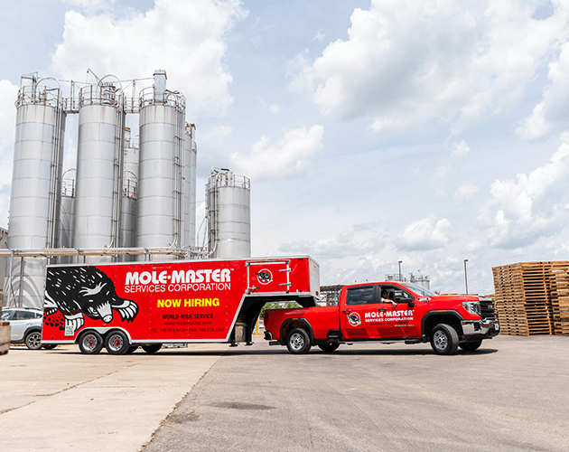 Mole&middot;Master&reg; truck and trailer at aluminum smelter site: 40+ years of alumina silo cleaning expertise