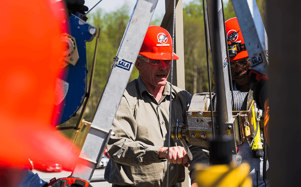 Safety instructor demonstrating winch operation