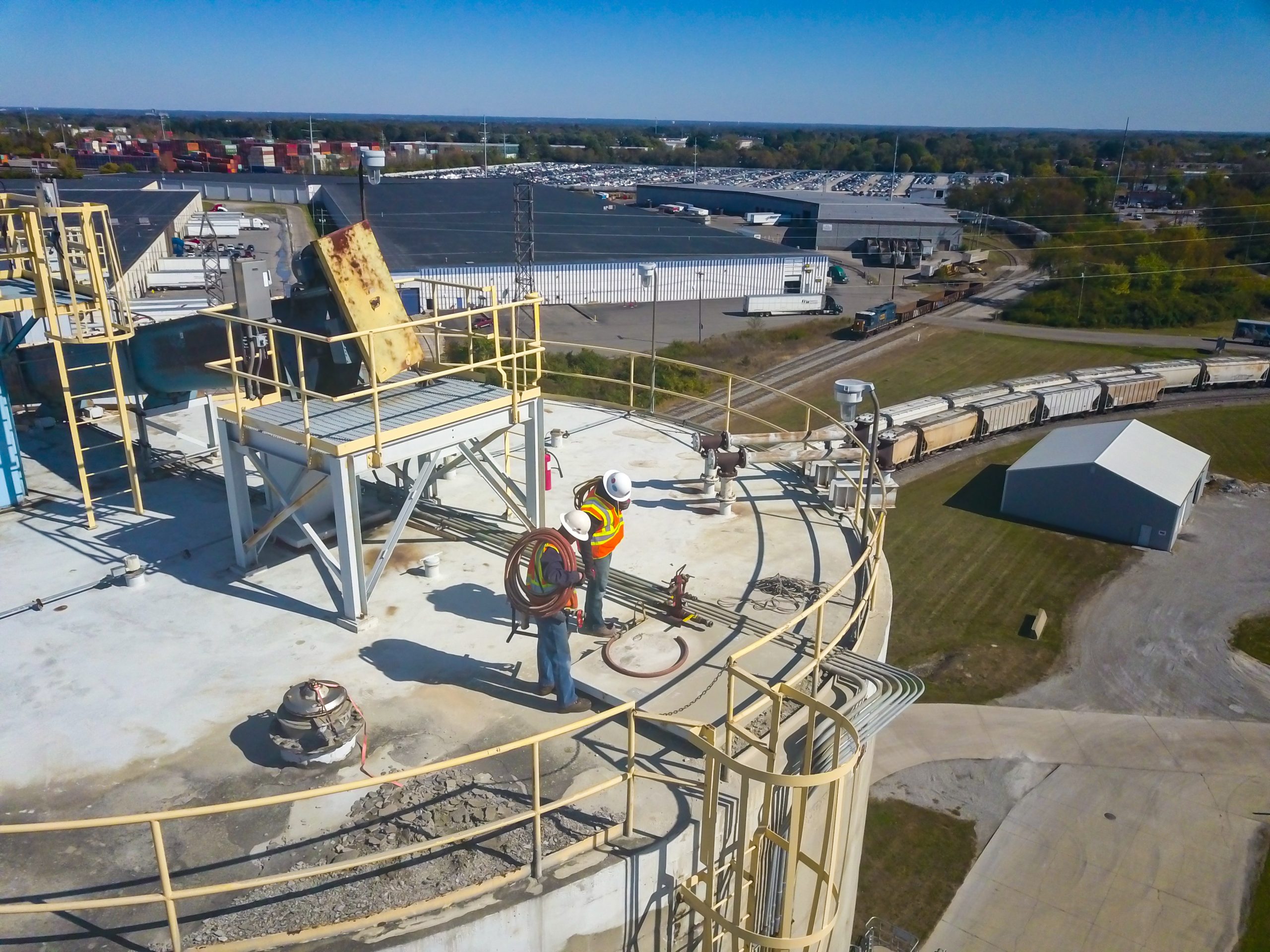Certified engineers on top of silo performing structural inspection